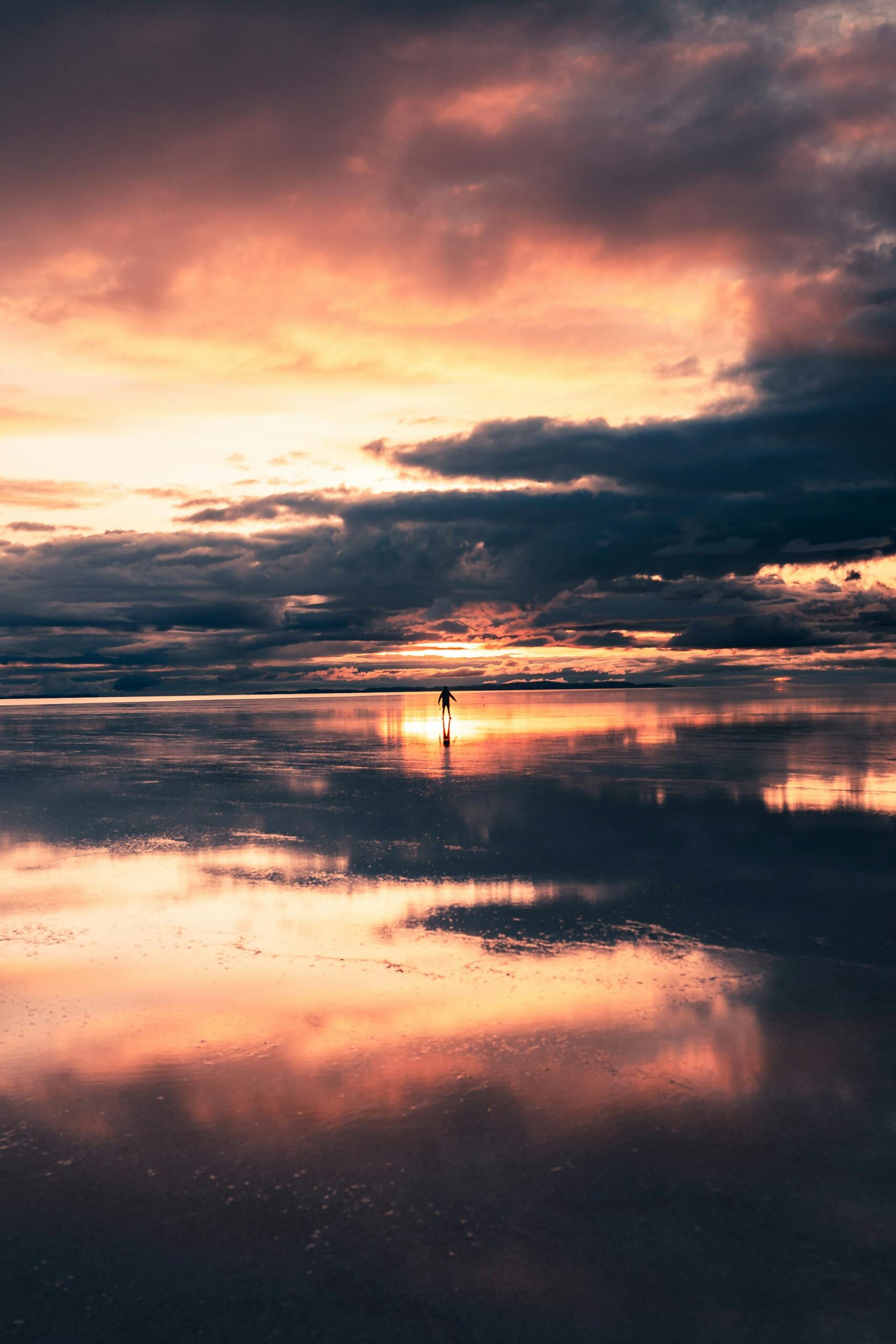 Vibrant sunset over the Salar de Uyuni salt flats in Bolivia